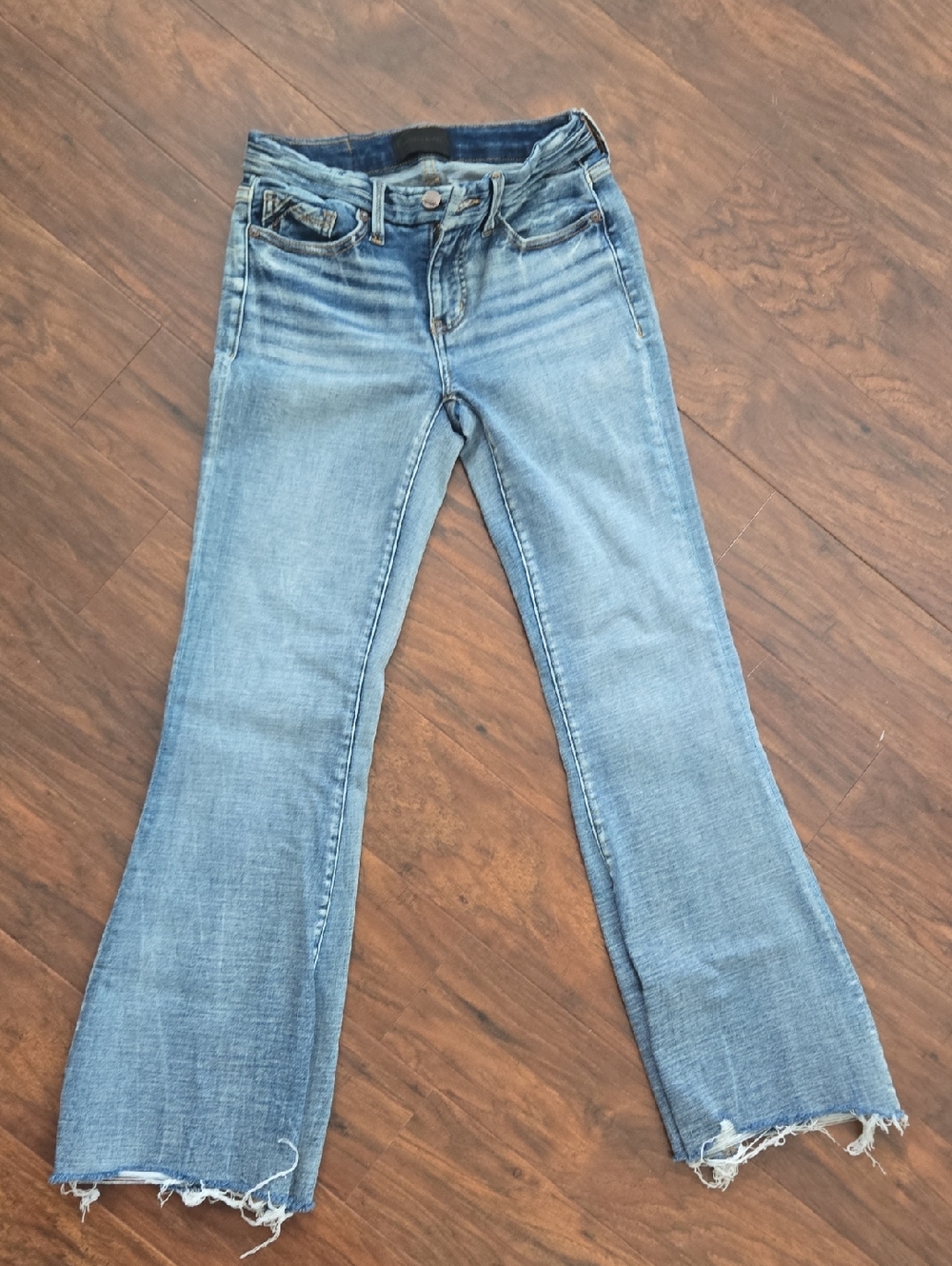 Buckle Light Blue Flare Jeans with Raw Hem